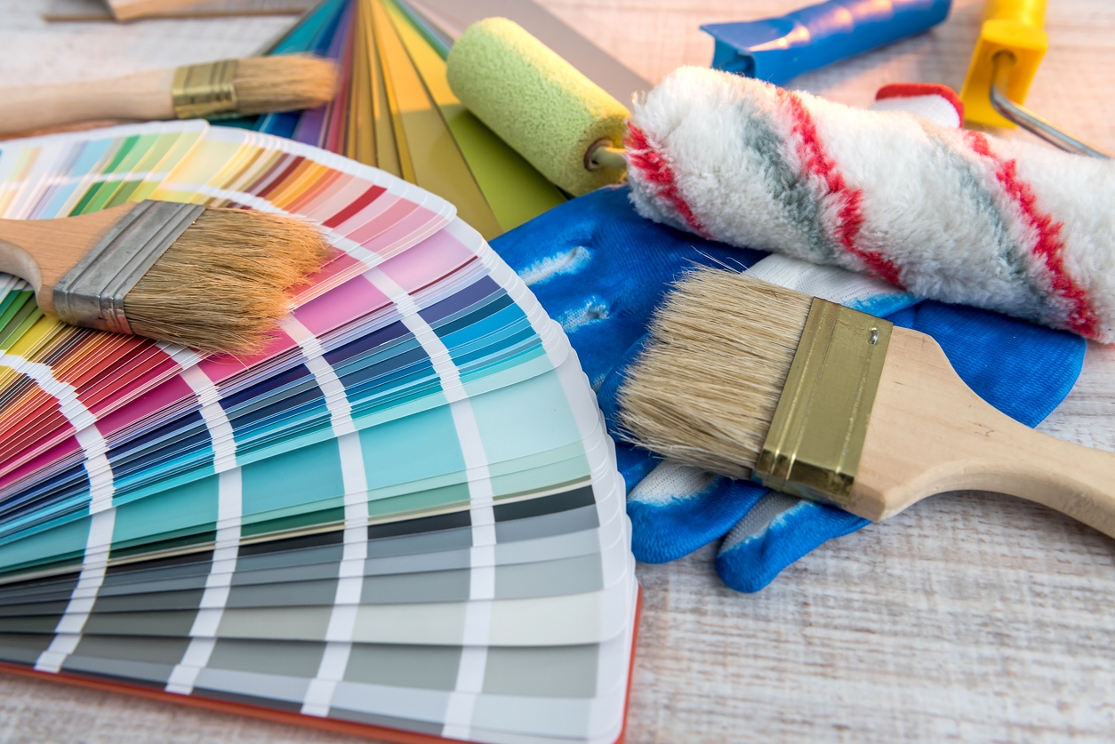 Tool paint palette and paintbrush, blue gloves for repair house